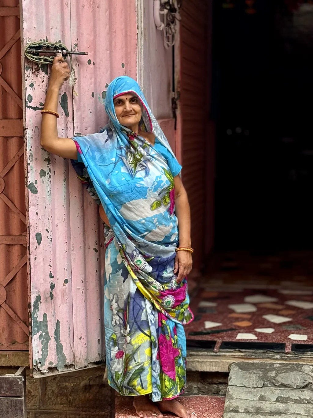 Beautiful Lady Standing Near Iron Sheet Gate